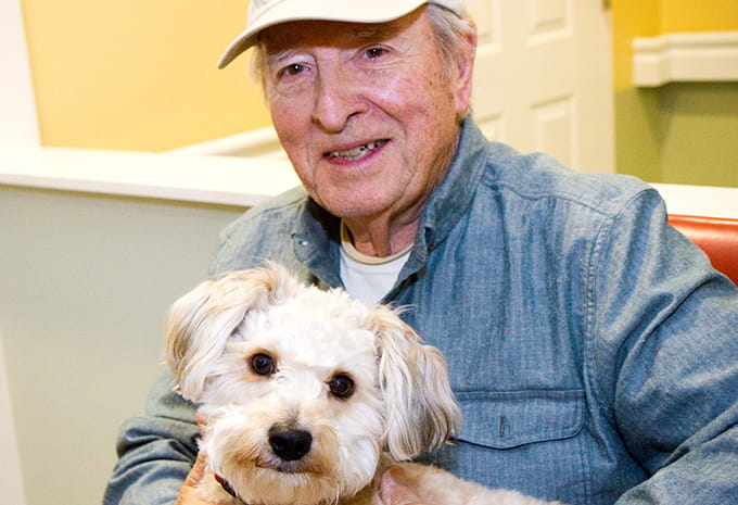Brightview Wellspring Village Dementia Care Resident enjoying the day with Max the dog